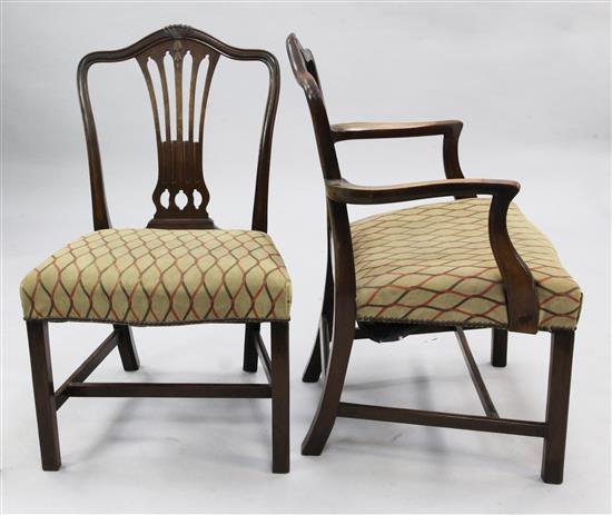 A set of eight George III Hepplewhite style mahogany dining chairs,